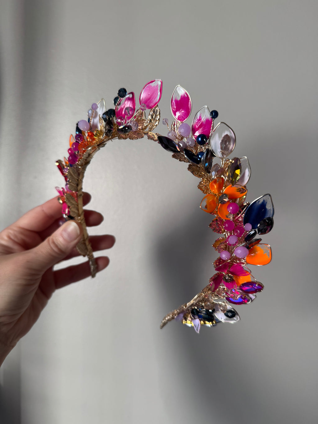 Fucshia, Navy and Orange pointed crown Fucshia, Navy and Orange pointed crown Precius pearls
