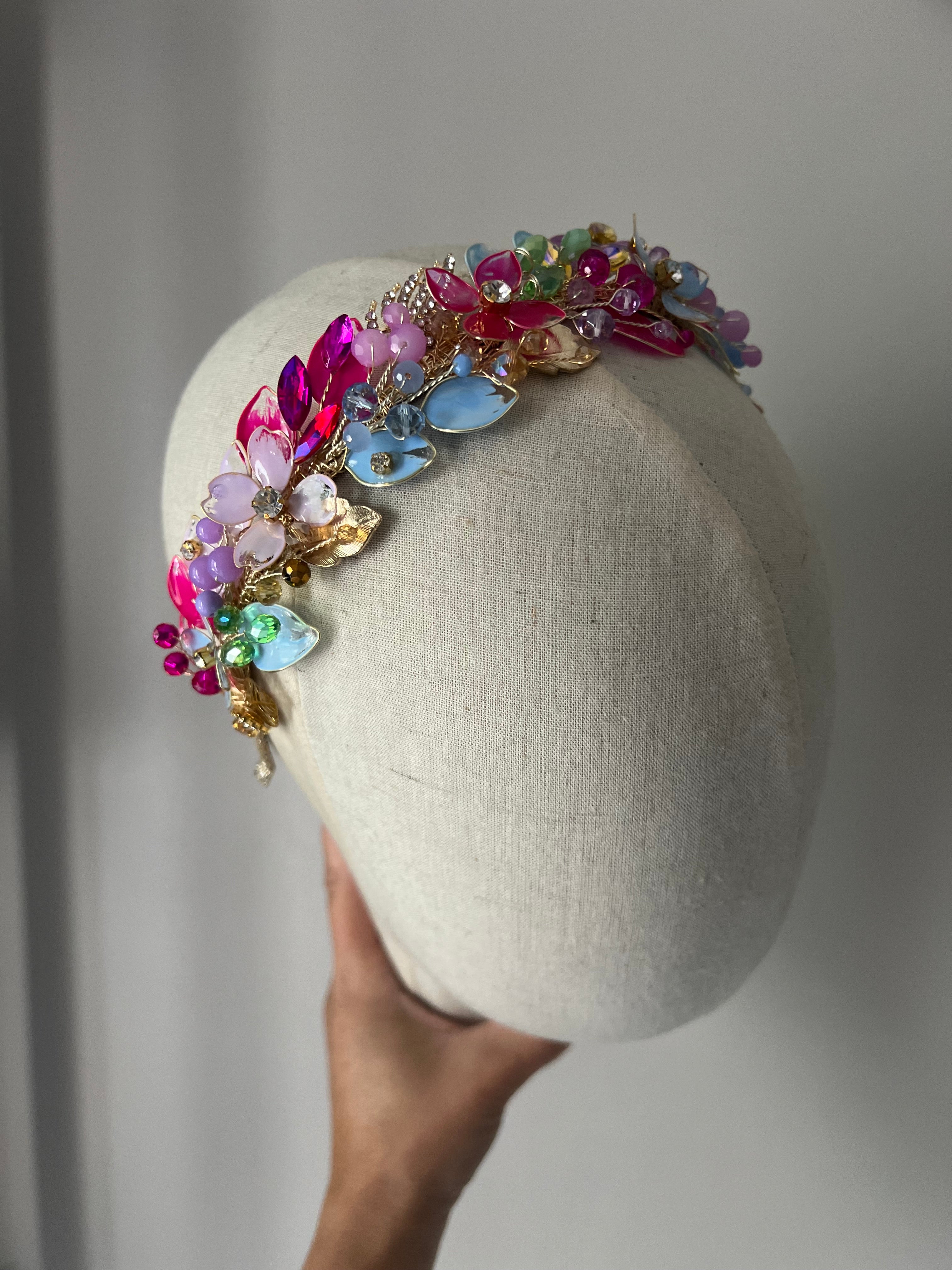 Lilac, blue and Fucshia detail low style headpiece Lilac, blue and Fucshia detail low style headpiece Precius pearls