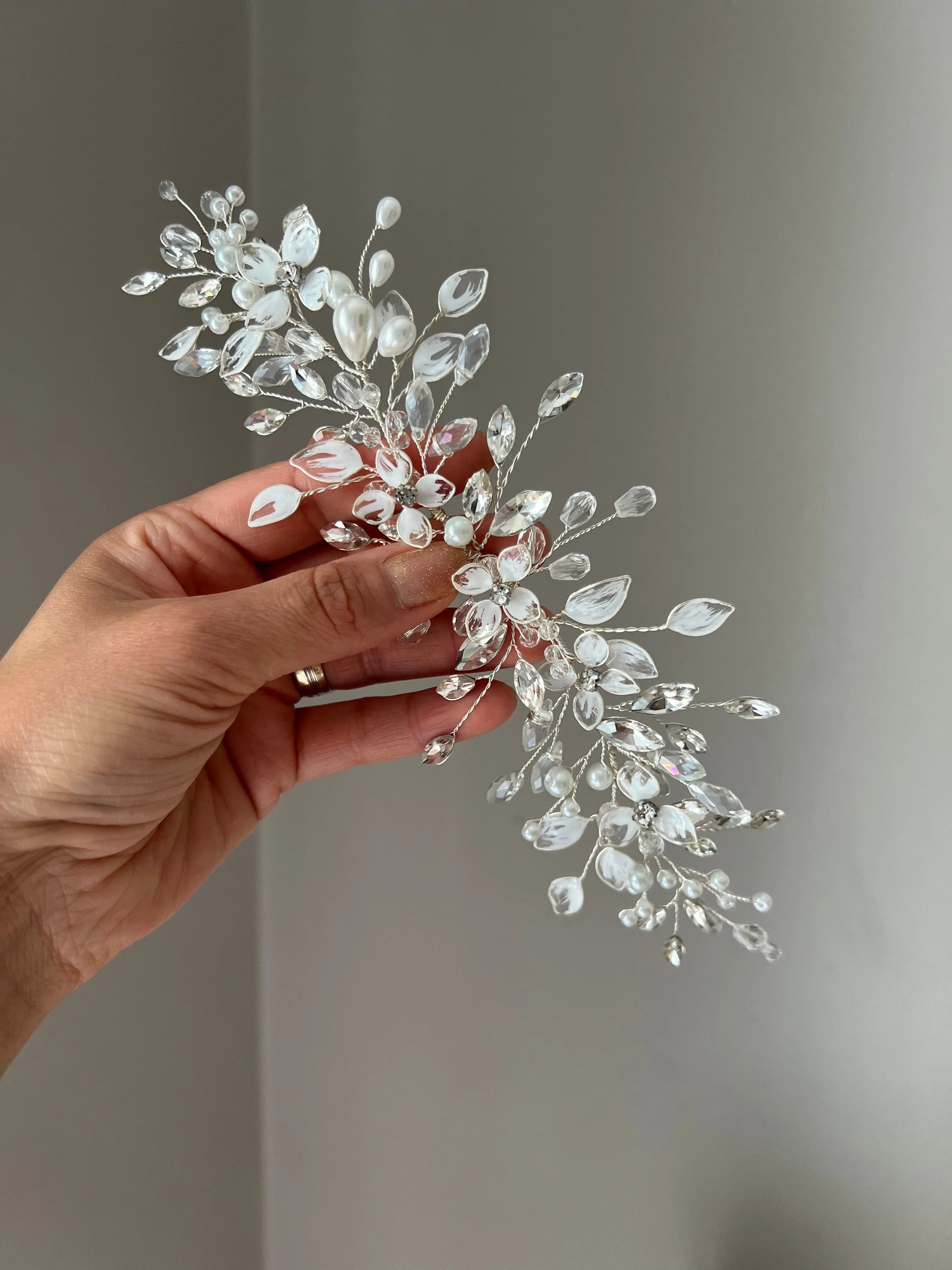 Delicate bridal vine with flowers and leaves Delicate bridal vine with flowers and leaves Precius pearls