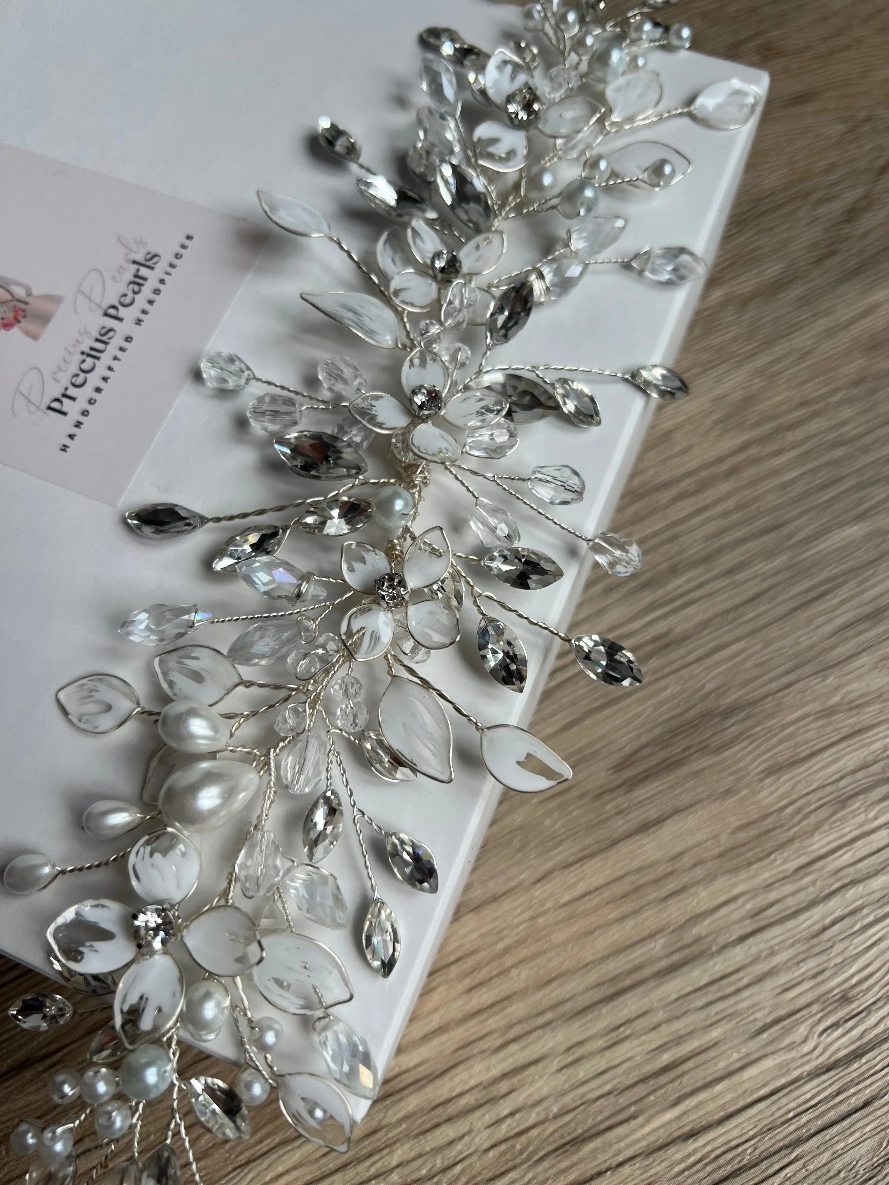 Delicate bridal vine with flowers and leaves Delicate bridal vine with flowers and leaves Precius pearls