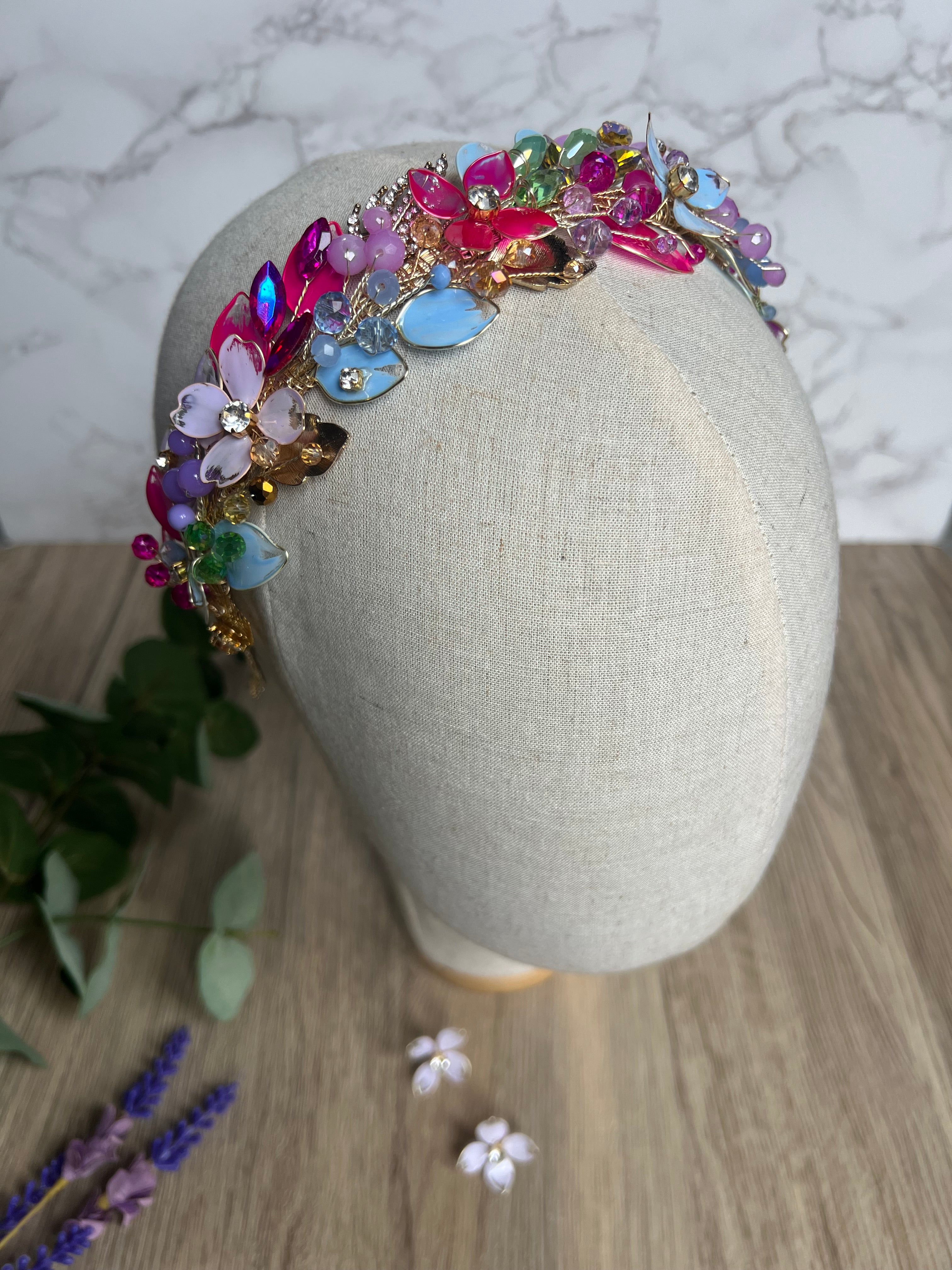 Lilac, blue and Fucshia detail low style headpiece Lilac, blue and Fucshia detail low style headpiece Precius pearls